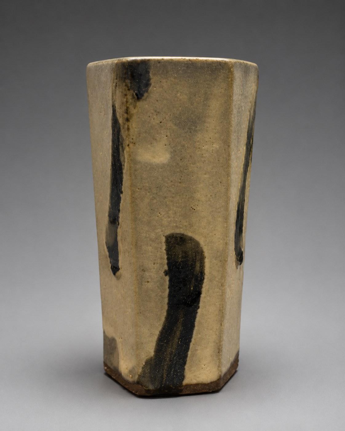 Hamada Shoji — Vase, poured glaze. A Hexagonal Stoneware Vase with Poured Iron Glaze Design, Japanese stoneware, Showa period, 20th century.