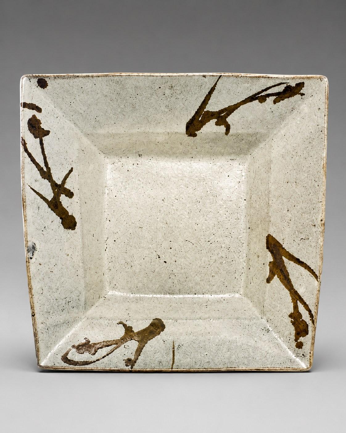 Hamada Shoji — Dish, grasses. A Large Stoneware Square Dish with Grasses Design, Japanese stoneware, Showa period, 20th century.