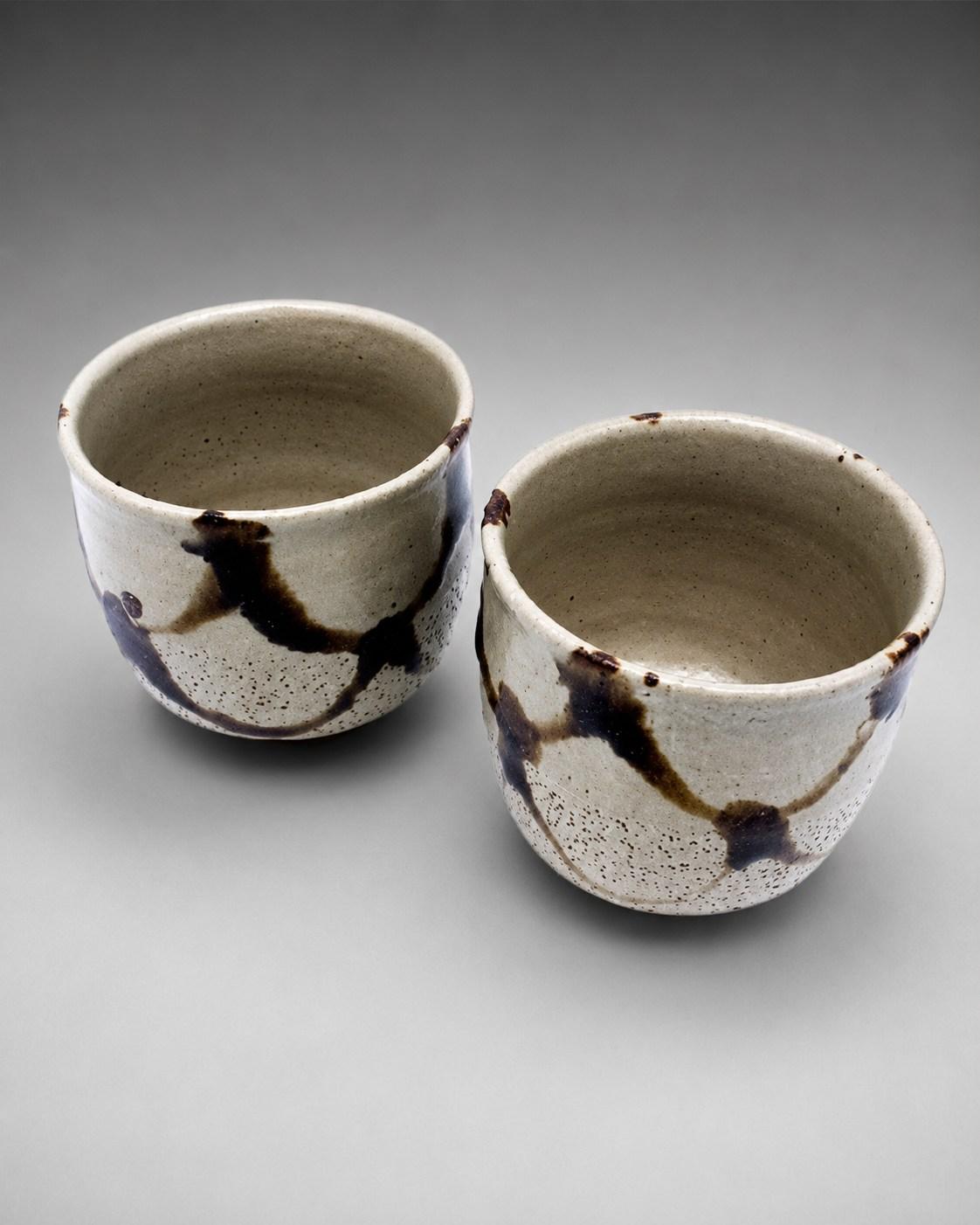 Hamada Shoji — Chawan / Tea Bowl. Two Stoneware chawan [tea bowls], Japanese stoneware, Showa period, 20th century.