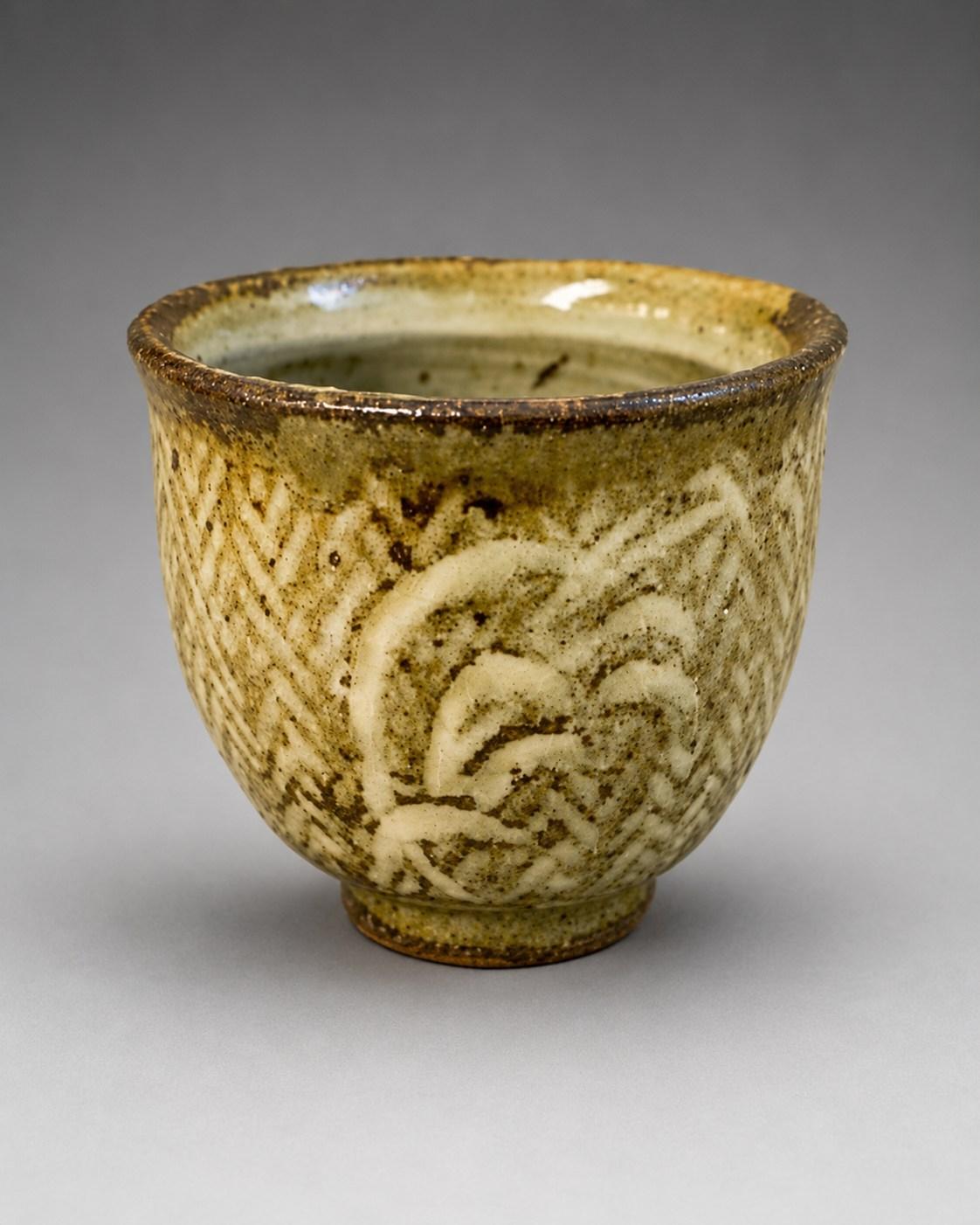 Shimaoka Tatsuzo — Sakazuki / Sake Cup, grasses. A Stoneware sakazuki [sake cup] with Grasses Motif, Japanese stoneware, Showa period, 20th century.